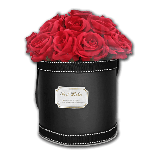 Μαύρο κυλινδρικό κουτί δώρου τύπου flower box με γυαλιστερή υφή και διακοσμητική κορδέλα με λευκό γαζί, γεμάτο με πλούσια σύνθεση από κόκκινα τριαντάφυλλα στην κορυφή (περίπου 21 τριαντάφυλλα), με ετικέτα “Best Wishes” στο μπροστινό μέρος—εντυπωσιακό ρομαντικό δώρο για Valentine’s Day, επέτειο ή ιδιαίτερη περίσταση – Eiria.gr