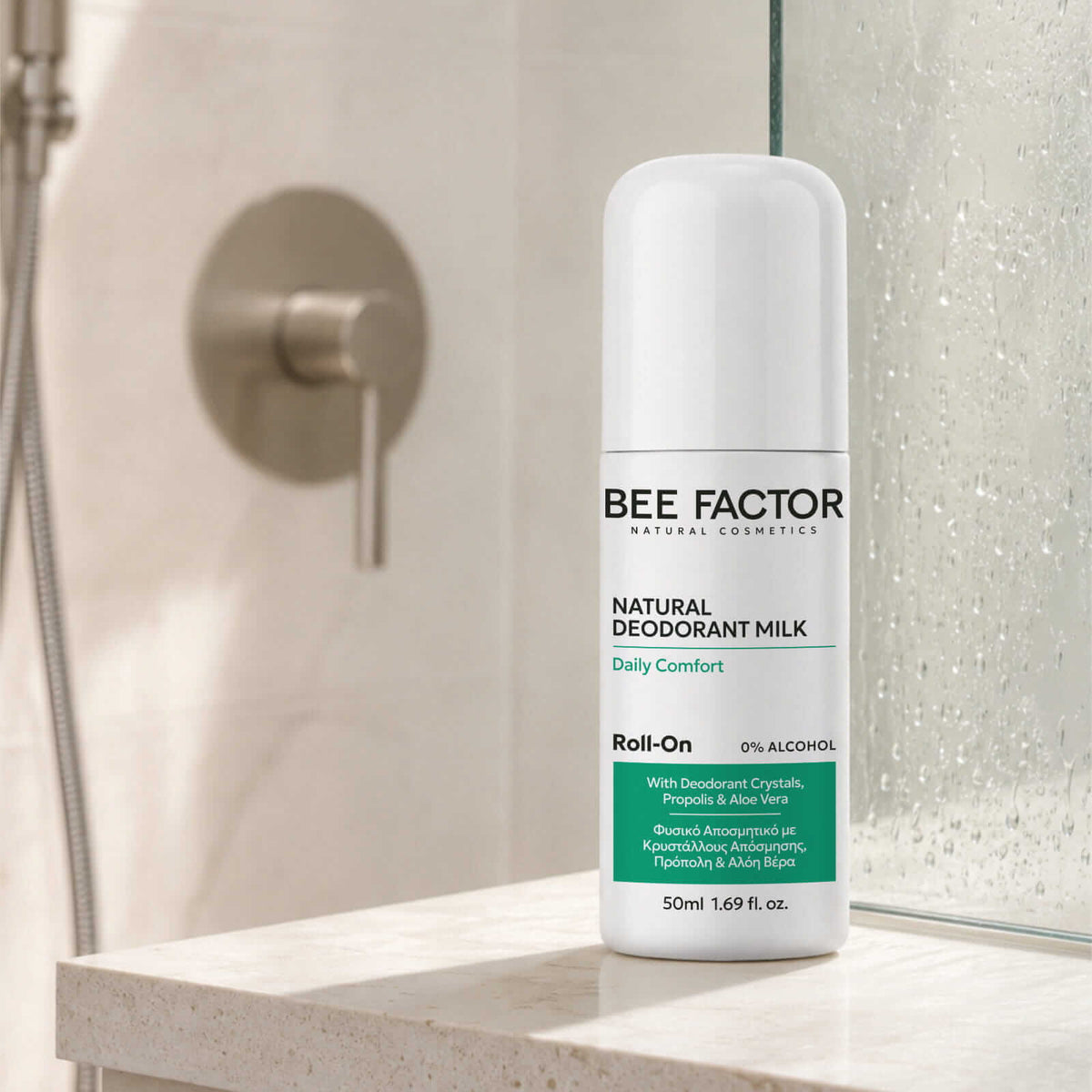 Bee Factor Natural Deodorant Milk 50ml roll-on τοποθετημένο σε μαρμάρινο πάγκο μπάνιου.